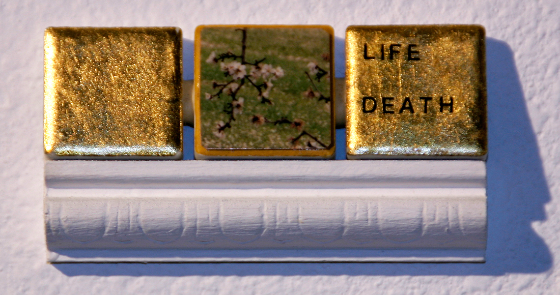 <br/>Day 5, 1998<br/>1" x 3"<br/>gold leaf, photo, acrylic and lettering on ceramic tiles